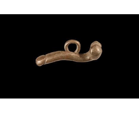 1st-2nd century AD. A silver pendant of a phallus with suspension loop to the underside. Cf. Rolland, H. Bronzes Antiques de 
