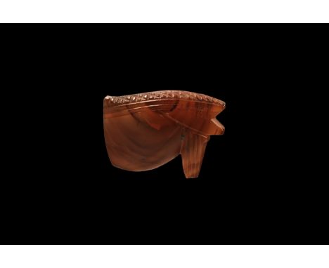 Third Intermediate Period, 1069-702 BC. A banded carnelian wedjat amuletic bead, convex to both broad faces, one with carved 