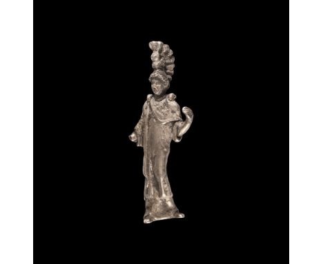 2nd century BC - 1st century AD. A hollow-formed silver statuette of Athena standing robed with mantle and left arm raised to