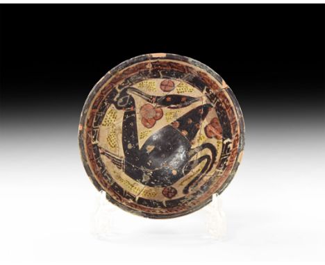 12th-13th century AD. A ceramic bowl with glazed decoration of a large bird to the centre with crest and legs bent under body
