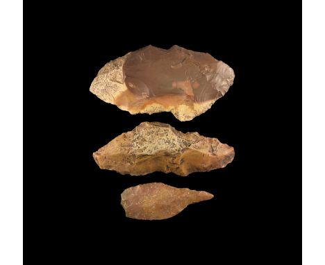 Palaeolithic Period, 100,000 - 50,000 Years BP. A group of three flint tools with knapped edges and points, one with rounded 