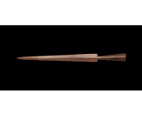 9th-11th century AD. An iron spearhead with slender lozenge-section triangular blade, sharp shoulders, octagonal-section sock