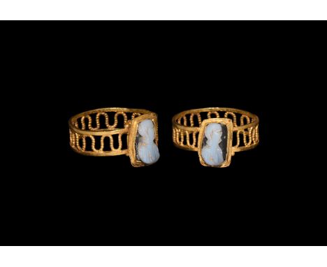 3rd-4th century AD. A gold finger ring comprising a flat openwork hoop with beaded wire meander between plain bands, hollow-f