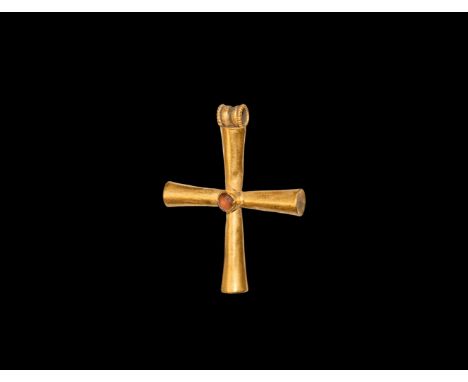 5th-7th century AD. A gold cross pendant formed as four conical hollow arms, beaded wire to the suspension loop, central cell