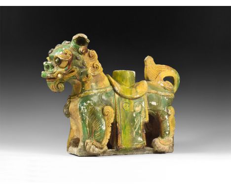 Ming Dynasty, 1400-1600 AD. A very large hollow-formed glazed ceramic incense burner in the shape of an armoured guard-dog on