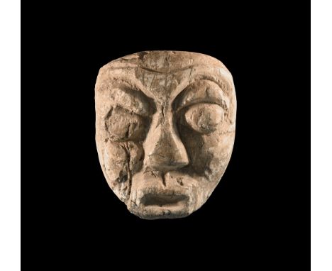 Pliocene Period, 5.2 - 2.5 million years BP. A mastodon fossil tooth with later facial carving, from Island of Java. 28 grams