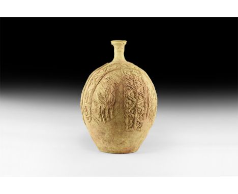 12th century AD. A ceramic jug with bulbous body and narrow stepped neck, chamfered rim to the mouth; bands of applied and sc