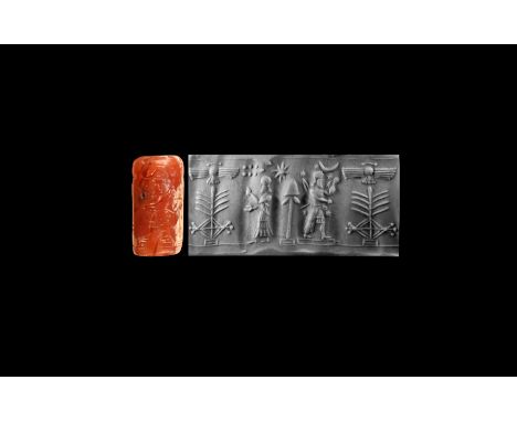 9th-7th century BC. A carnelian cylinder seal with antithetical scene consisting: in the centre, of a winged disc, symbol of 