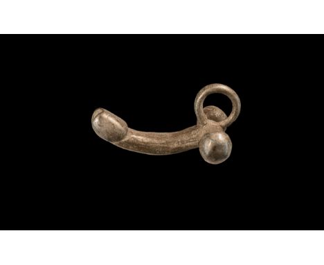1st-2nd century AD. A silver pendant of a phallus with suspension loop to the rear. Cf. Rolland, H. Bronzes Antiques de Haute