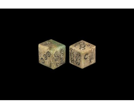 1st-3rd century AD. A pair of cuboid bone dice, ring-and-dot spots to each face arranged 6:1, 2:5, 3:4. Cf. Allason-Jones, L.