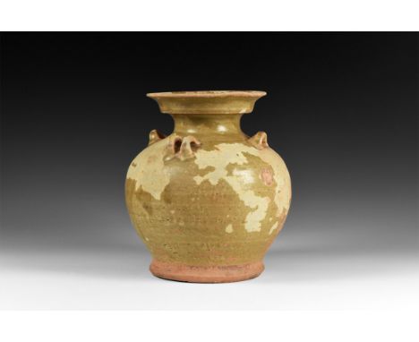 Tang Dynasty, 618-906 AD. A ceramic jar with rounded shoulder, waisted neck with shallow gallery, flared rim; two sets of two