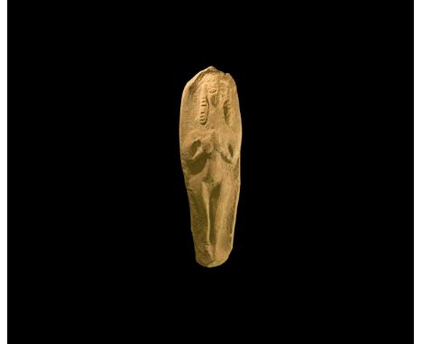 7th-5th century BC. A tongue-shaped ceramic plaque with a high-relief standing figure of a nude woman holding her breasts, we