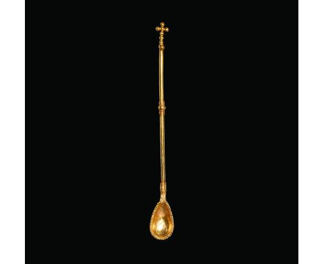11th-12th century AD. A gold baptismal spoon with slender round-section shank, piriform bowl with beaded rim, coiled filigree