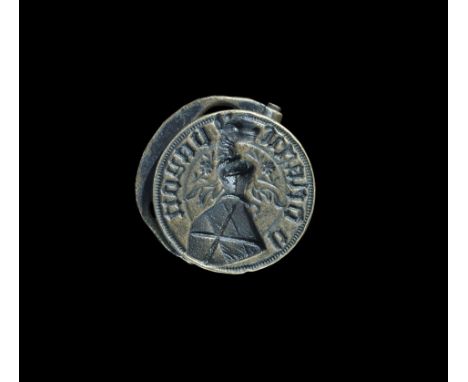 15th-16th century AD. A discoid seal matrix with hinged handle to the reverse, '*' symbol for alignment; the heraldic face wi