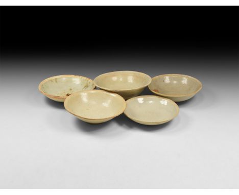 Song Dynasty, 960-1127 AD. A mixed group of glazed ceramic bowls and dishes. 831 grams total, 13.5-15cm (5 1/4 -6"). From an 