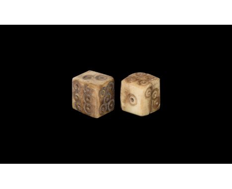 1st-2nd century AD. A pair of bone dice with ring-and-dot spots disposed 1:6, 2:4, 3:5. Cf. Allason-Jones, L. & Miket, R. The