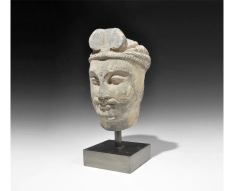 1st-3rd century AD or later. A schist head of a Bodhisattva with finely carved features and moustache, urna, plaited band and