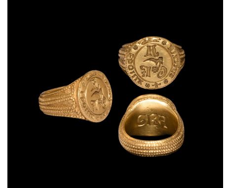 15th century AD. A substantial European gold finger ring comprising a broad hoop with six bands of pellet detailing to the ou