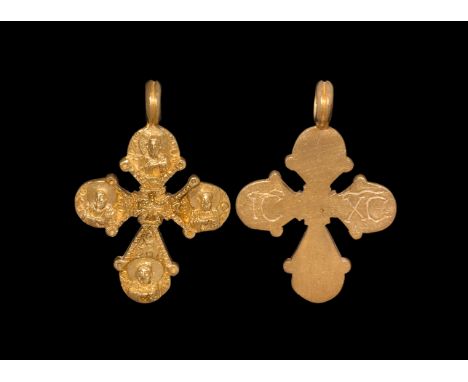 11th-12th century AD  A gold cruciform pendant with gusset to the loop, nimbate bust and text to the discoid finial of each a