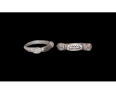 11th-12th century AD. A silver finger ring comprising a cusped D-section hoop with chevrons and pellets, Romanesque style bea