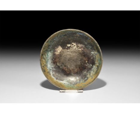 6th-9th century AD. A broad dish with chamfered rim, punched-point motif to the inner face of a bird with collar and triangul