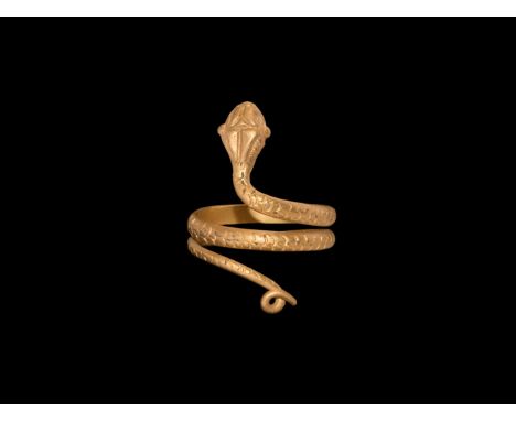 Ptolemaic Period, 332-30 BC. A gold finger ring formed as a D-section serpent with loop to the tail, scale detailing, lozengi