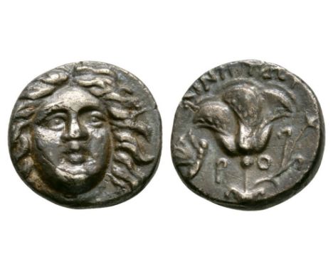 205-190 BC. Magistrate Ainetor. Obv: head of Helios facing slightly right. Rev: AINHTWR above, R-O across fields, rose with b