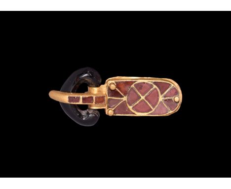 6th century AD. A buckle set of garnet and gold elements comprising: D-shaped garnet loop with expanded outer edge; gold tong