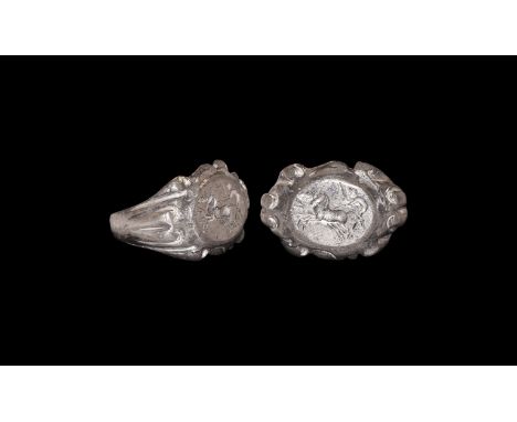 3rd century AD. A silver finger ring comprising a narrow flat-section hoop, flared shoulders with vertical rib detailing, scr
