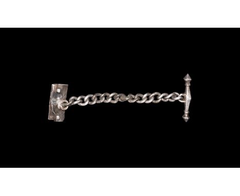 1st-2nd century AD. A silver chain with octagonal-section facetted transverse bar with knop finials; attached through a loop 