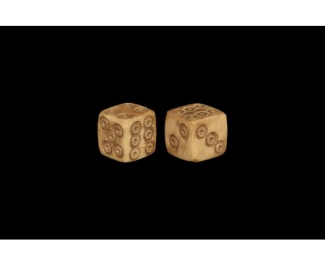 1st-3rd century AD. A pair of cuboid bone dice, ring-and-dot spots to each face arranged 6:1, 2:4, 3:5. Cf. Allason-Jones, L.
