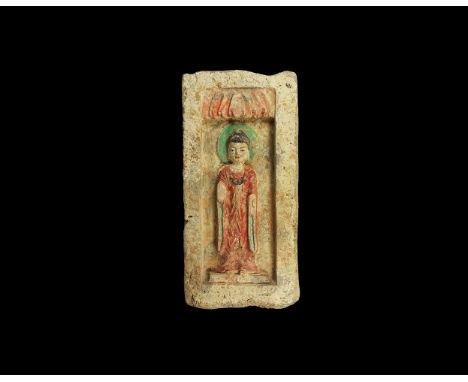 Northern Wei Dynasty, 386-535 AD. A ceramic rectangular brick with recessed front panel; to the centre in high relief standin