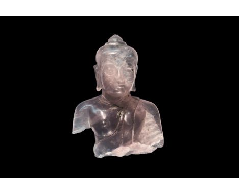 19th century AD. A carved amethyst figurine fragment of Buddha with robe over the left shoulder, cap with tiered apex; traces