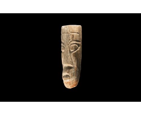 Pliocene Period, 5.2 - 2.5 million years BP. A Mastodon fossil tusk with later facial carving, from the island of Java. 49 gr