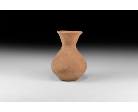 Neolithic Period, 3rd millennium BC. A ceramic biconical jar with flared rim, incised line to base of neck. 496 grams, 16cm (