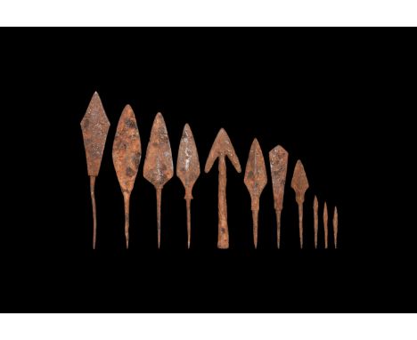 11th-15th century AD. A group of iron arrowheads comprising: one socketted swallowtail type; five tang leaf-shaped; one tange