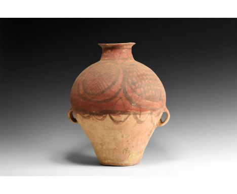 3rd millennium BC. A bulbous ceramic jar with two small loop handles, narrow base and trumpet-shaped rim; decorated to the up