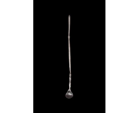 1st-2nd century AD. A silver medicinal or cosmetic spoon with broad bowl, balustered shank with rib to the grip, probe finial