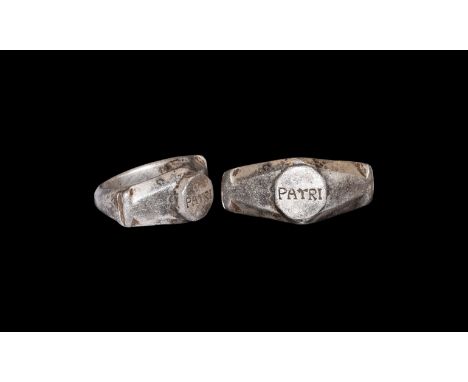 3rd century AD. A silver finger ring comprising a D-section facetted hoop, chamfered shoulders with split bar finials, octago