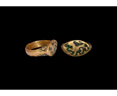 13th-14th century AD. A gold finger ring comprising a substantial D-section cusped hoop with reserved foliage tendrils on a g