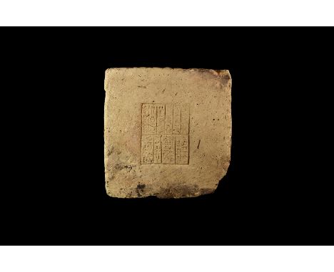 7th-6th century BC. A large square ceramic slab with recessed square central panel divided into ten rectangular zones each wi