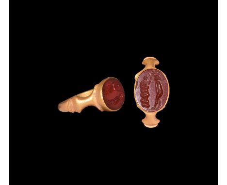 3rd century AD. A gold finger ring comprising a D-section hoop with ribbed collar and flared shank to each shoulder, discoid 