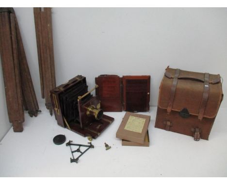 A Rastrick, Son and Co mahogany and brass plate camera and accessories to include a tripod, glass plates boxed, two plate hol
