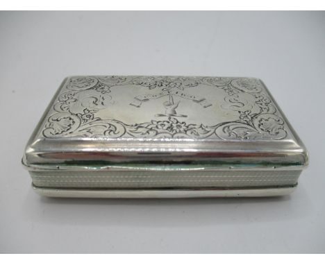 A George IV silver snuff box, Birmingham 1823 by Thomas Shaw, of rectangular form, with engine turned decoration and floral e