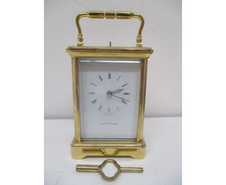 A Mappin &amp; Webb brass repeater carriage clock having white enamel dial with Roman numerals and Breguet style handles. The