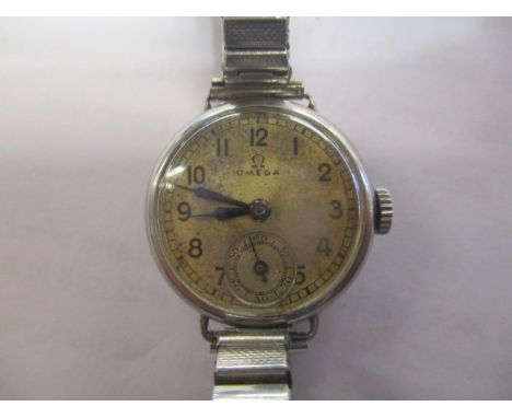 An Omega ladies stainless steel manual wind wristwatch having Arabic numerals, subsidiary seconds and a later expanding brace