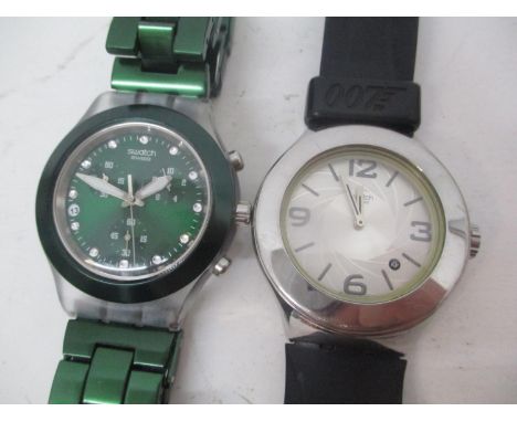 Two Swatch Irony gents wristwatches to include a 007 stainless steel watch on a black leather strap, and the other a Swatch D