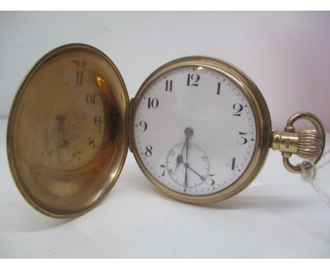 An early 20th century Zenith 9ct gold full Hunter, keyless wound pocket watch.  The white enamel dial having Arabic numerals 