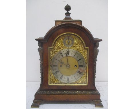 A late 19th/early 20th century walnut bracket clock. The dial having a matted centre, silvered chapter ring with Roman numera