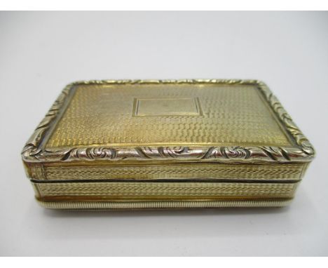 A George IV silver gilt snuff box, Birmingham 1827, by Thomas Newbold, of rectangular form, with engine turned decoration and